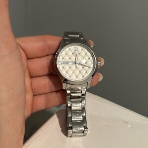 Armani Exchange silver watch with small diamonds and pearl quilted face.